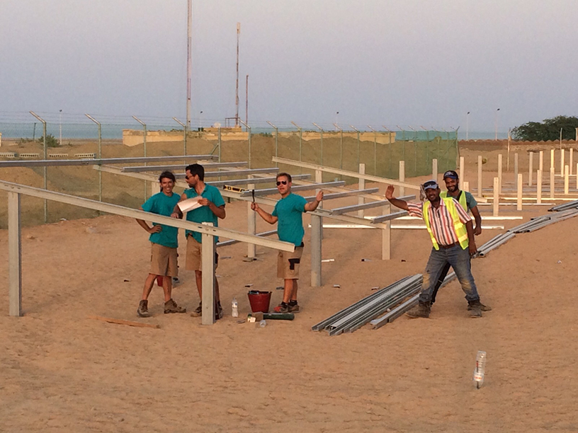 Installation team at Aburamad Solar Park Egypt – assembling photovoltaic ground mounting systems in desert environment