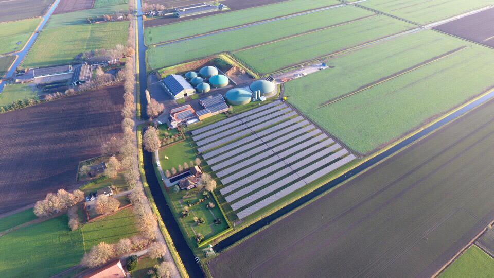 Aerial view of the Nieuw-Balinge solar park with PV modules installed near biogas facilities in the Netherlands