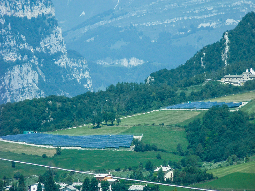 Solar farm in Sant’Anna d’Alfaedo, Italy surrounded by mountains and greenery