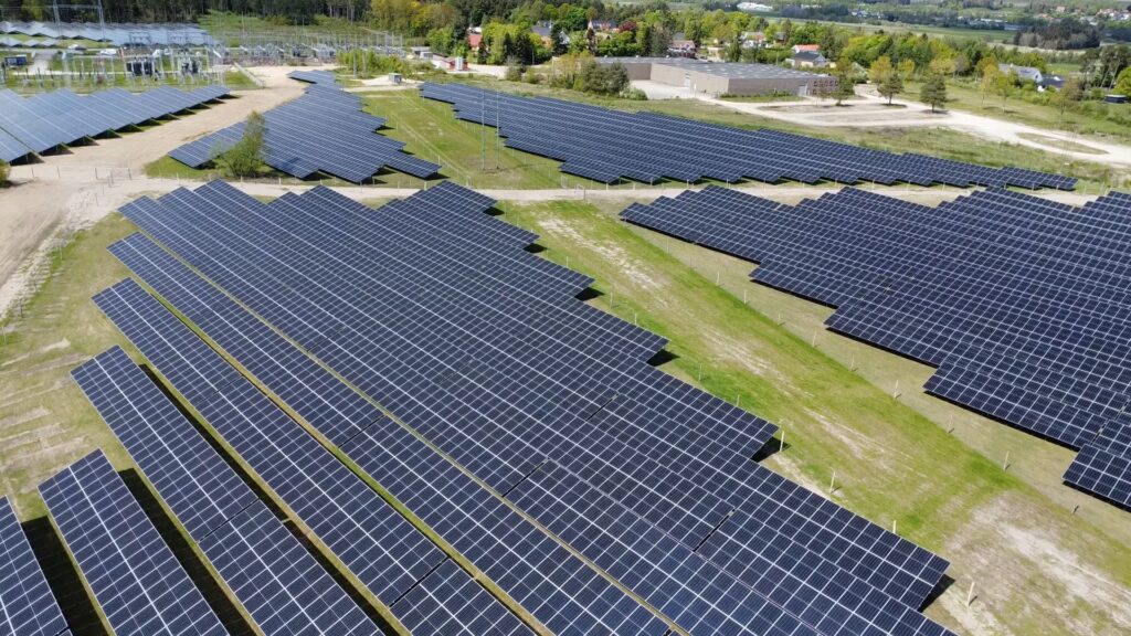 Ground-mounted photovoltaic system in Mesballe, Denmark, with structured module arrays and internal access routes